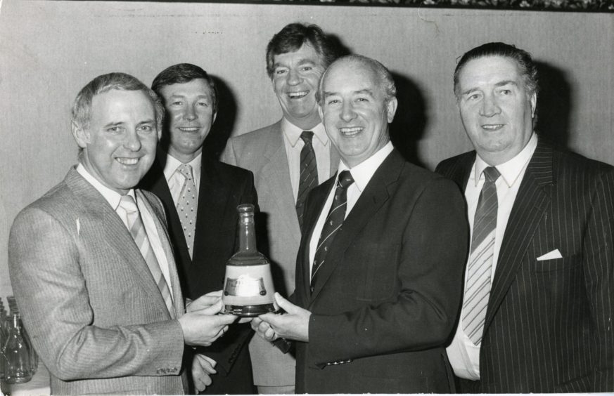 A presentation of a Bell's decanter is made to Dundee United manager Jim McLean at his testimonial dinner. 
