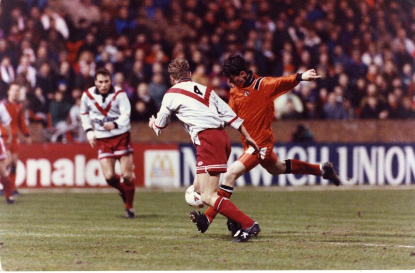 Andy McLaren scores against as Jimmy Sandison looks on