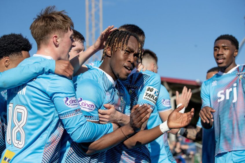 The Dunfermline Athletic F.C. players celebrate Ewan Otoo's opener against Arbroath.