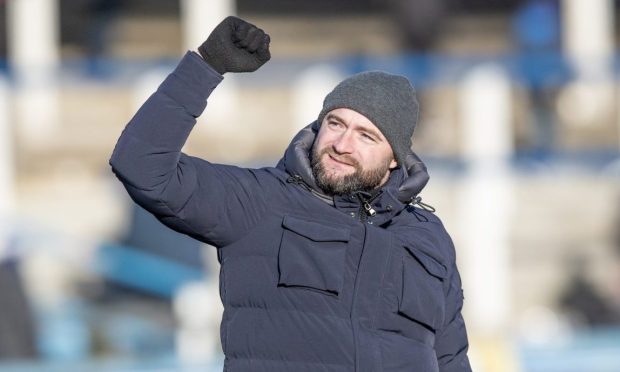 Dunfermline manager James McPake celebrates with the supporters after victory over Morton.
