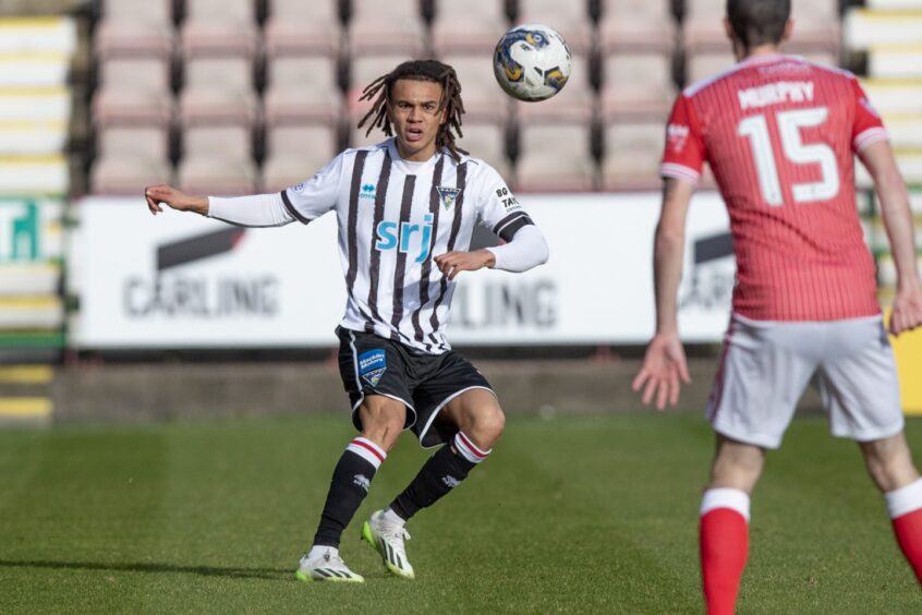 Miles Welch-Hayes chips a pass forward for Dunfermline Athletic.