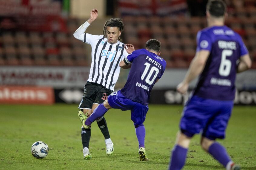 Airdrie skipper Adam Frizzell catches Dunfermline defender Miles Welch-Hayes on the knee with a tackle.