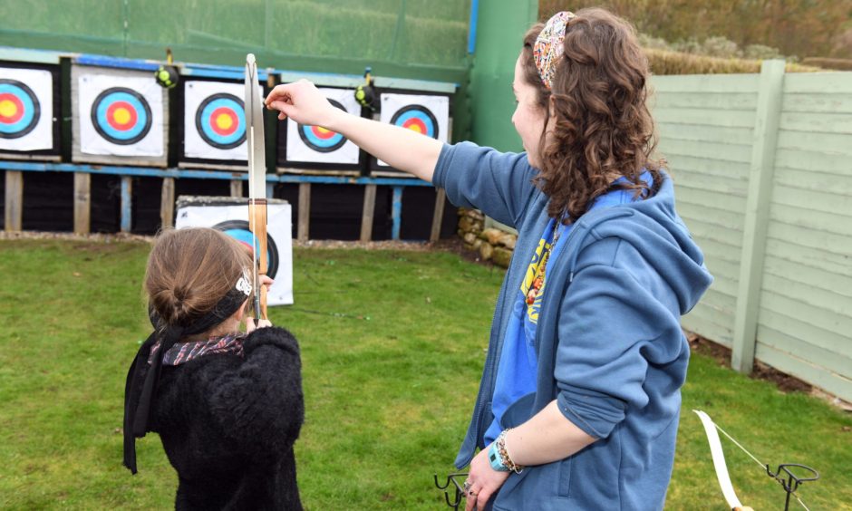 Marcy McAuslan (7) tries her hand at archer, courtesy of East Neuk Outdoors. 