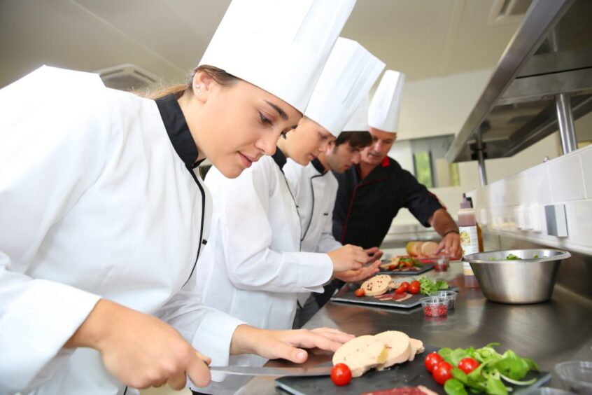 apprentices learn valuable skills in the kitchen