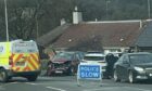 Police at the scene of the two-car crash on Foulford Road in Cowdenbeath.