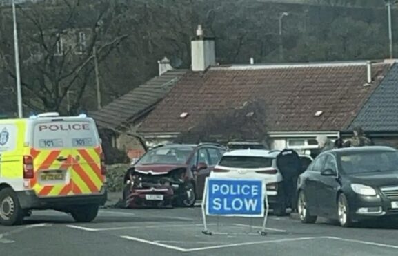 Police at the scene of the two-car crash on Foulford Road in Cowdenbeath.