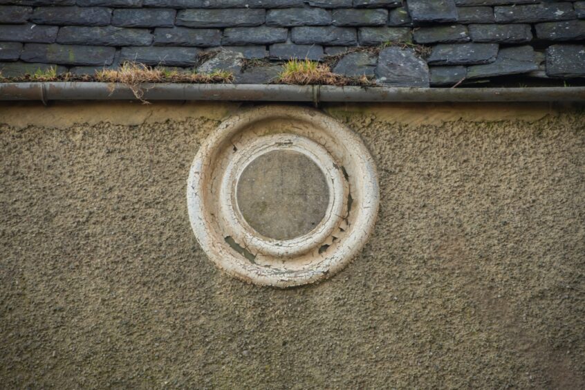 The roundel on the front of the building where the clock used to be.