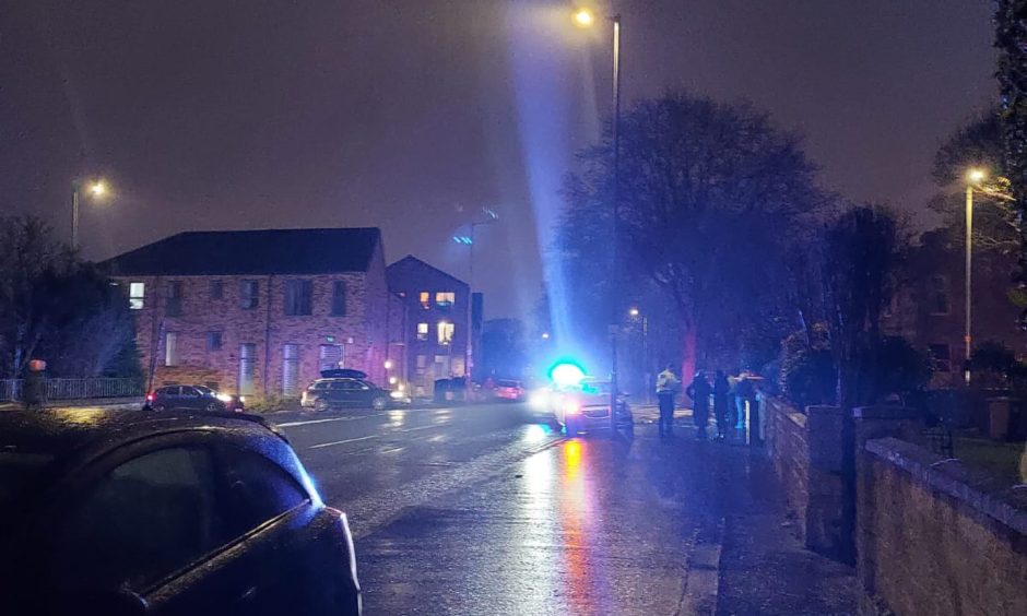Officers at the scene on Dalkeith Road after car crashes into garden wall