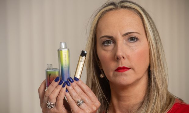 St Paul's RC Academy head teacher Kirsty Small with a selection of vapes found at the school.