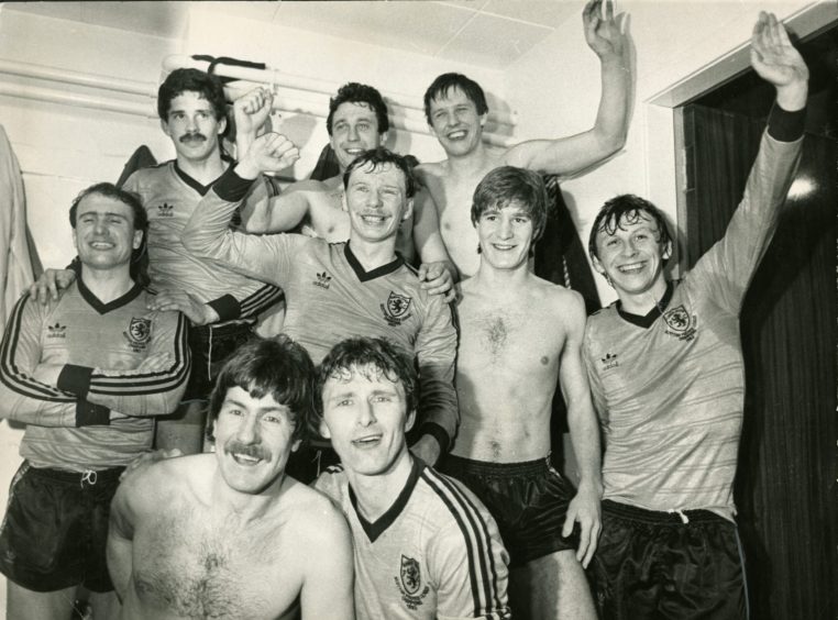 The jubilant Dundee players celebrate in the dressing room after beating Rapid Vienna