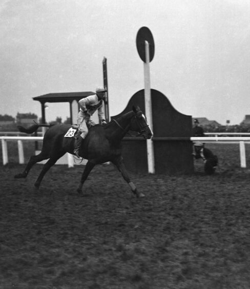 Master Robert ridden by Bob Trudgill crossing the finishing post of The Grand National in 1924.