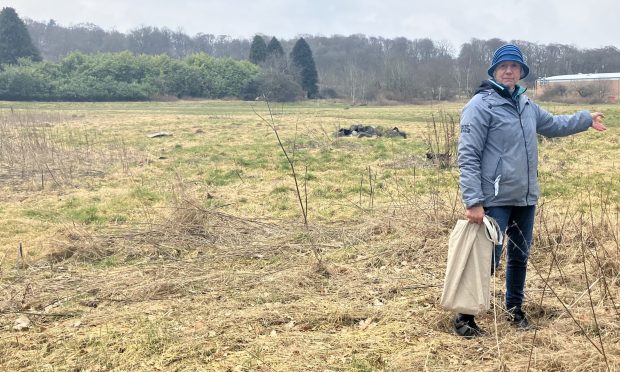 Leslie Martin stands in the former NCR field on the proposed Dundee FC site near Camperdown Park. Image: Finn Nixon/DC Thomson.