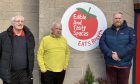 Picture shows; Rosyth residents (L-R) Allan Foote, Steven Stewart and Bruce Lumsden outside the EATS Rosyth Community Hub. Image: Finn Nixon/DC Thomson.