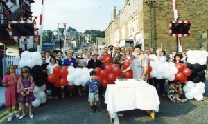 People in the street pose for a picture at a party held for the opening of the Broughty Ferry level crossing in 1995.