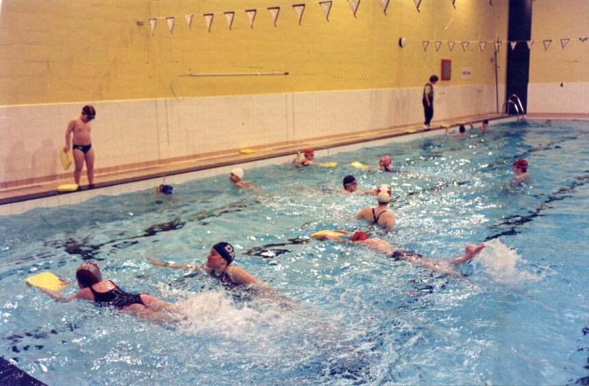 A busy swimming class during a lesson at Monifieth High School pool.