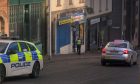 Police outside the hilltown shop after a breakin
