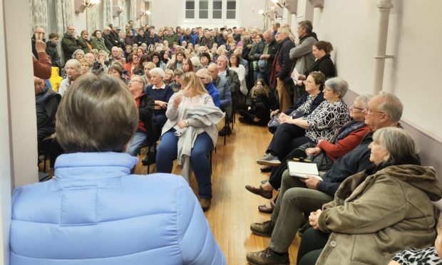 Residents pack out Errol Village Hall over bus cuts. Image: David Farrell