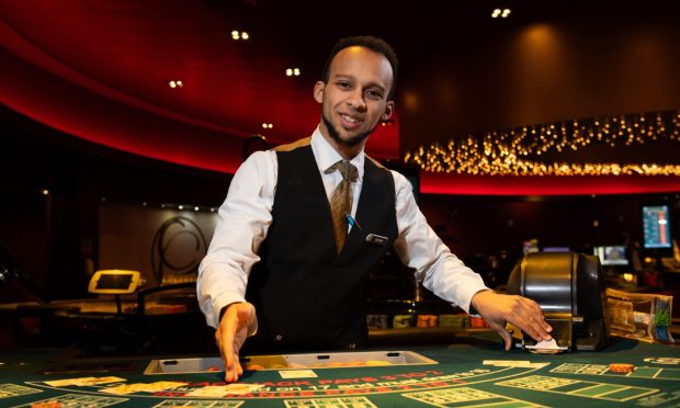 Croupier, Jordon Brown at one of the Black Jack Tables, Grovesnor Casino,