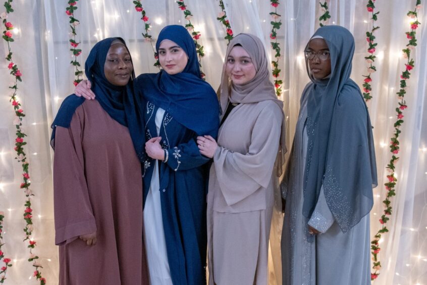 Girls pose for a photo at the Ramadan Iftar party at Morgan Academy.
