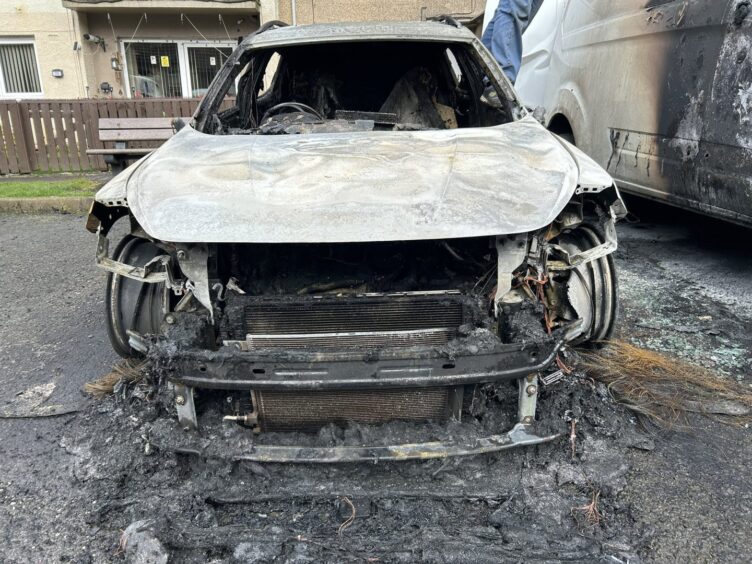 The burnt out wreckage of the Cupra. 