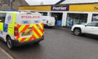 Police at Forfar Convenience Store on Market Street, Forfar.