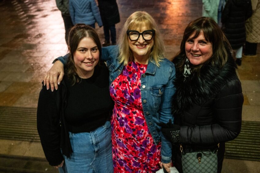 Leigh Flaherty, Jean Horrocks and Helen Stark wait on the steps of Caird Hall to enter Sarah Millican's Late Bloomer comedy show. 