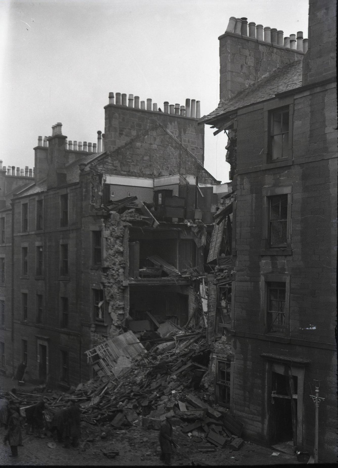 The obliterated building in Dundee leaves a gap in the row of tenements, with rubble and debris everywhere