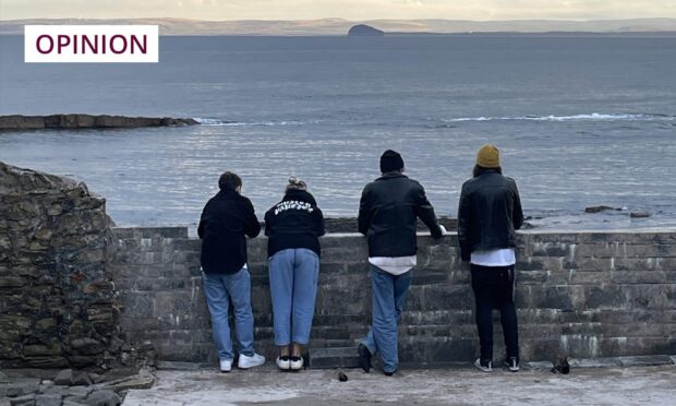 A new view on staycations: Rebecca's friends look out on to the water at Anstruther. Image: Rebecca Baird/DC Thomson.