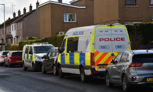 Two police vans outside a property on Strathtay Road, Perth. Image: Stuart Cowper.