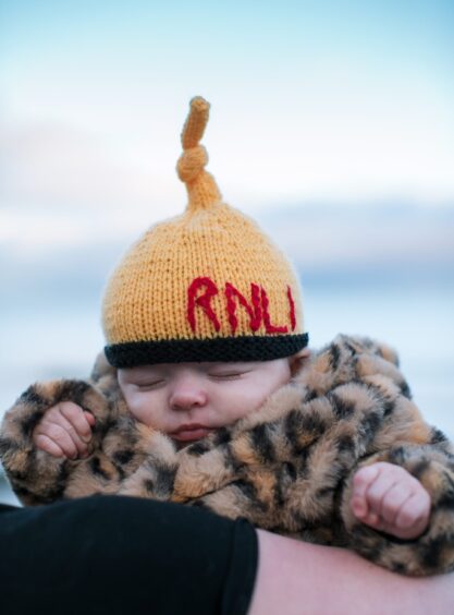Baby Ella, with RNLI wooly hat.