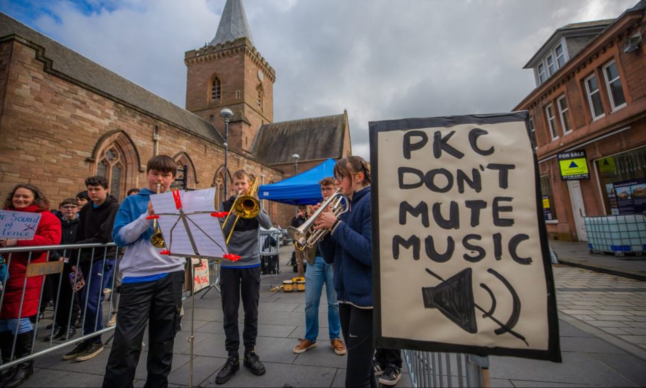 Protest against proposed music cuts in Perth.