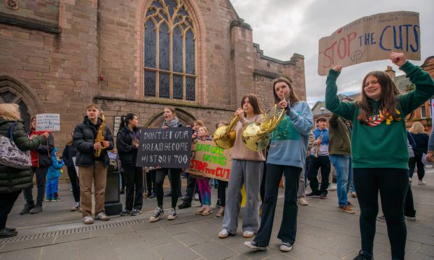 A protest took place outside the new Perth Museum against the planned cuts to Perth and Kinross Instrumental Music Service.