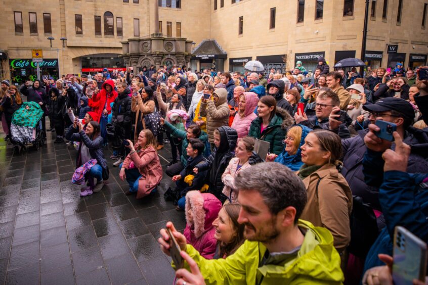 Large crowd watching enertainment in perth city centre on museum opening day