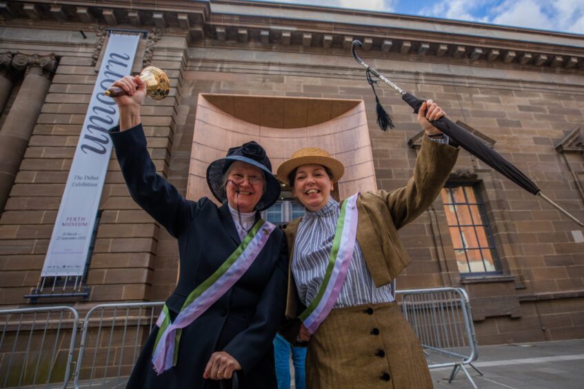 Two women dressed as suffragettes outside Perth Museum
