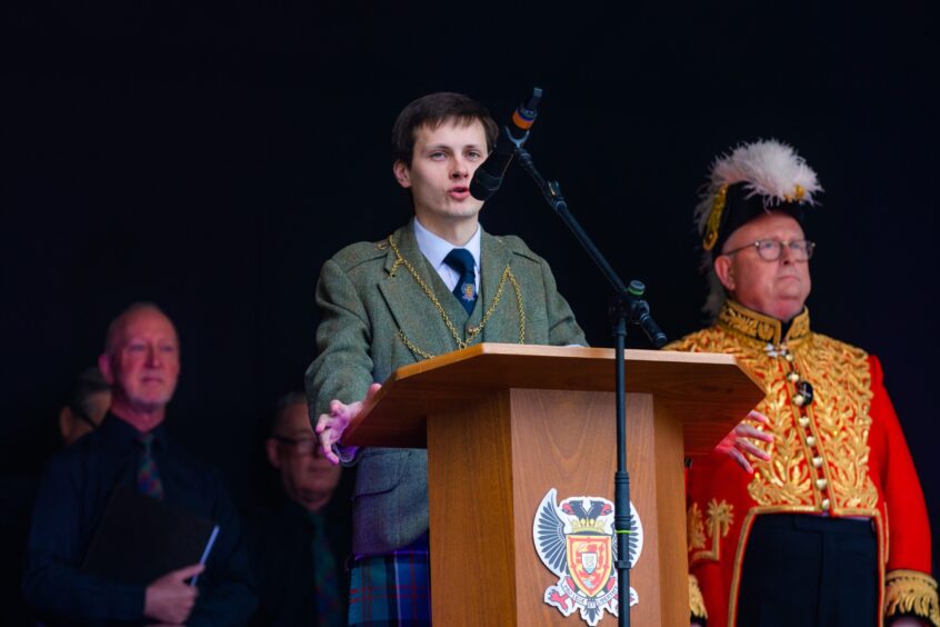 Perth and Kinross Provost Xander McDade speaking at a podium