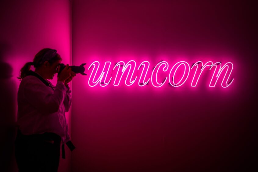 The neon start to the Unicorn exhibition space inside Perth Museum. 