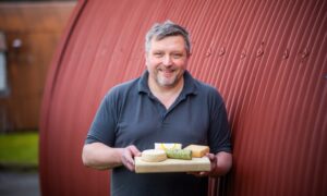 Pierre Leger with examples of their cheese  at Unit 15B Cultybraggan, Comrie Image: Steve MacDougall/DC Thomson