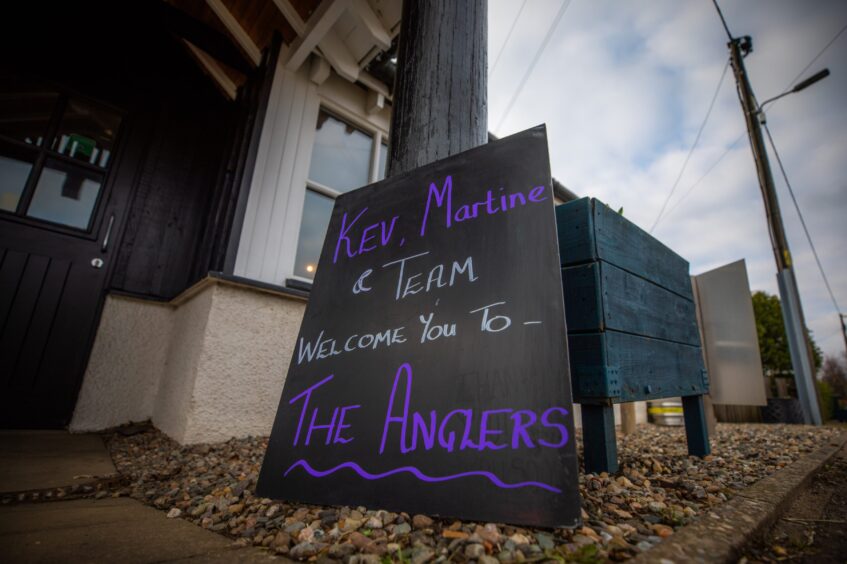 Board outside The Anglers, Guildtown, saying 'Kev, Martine and team welcome you to The Anglers'.