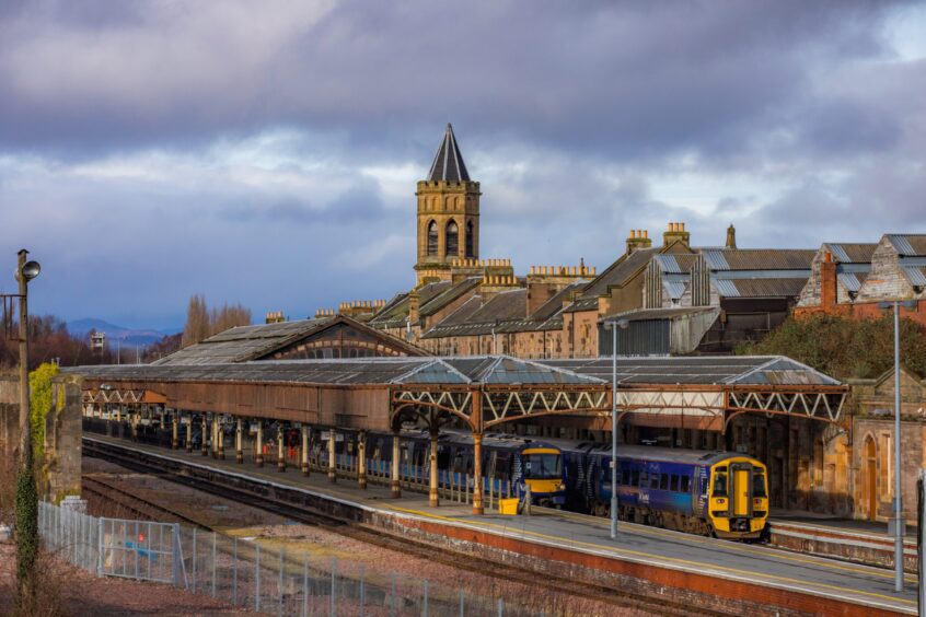 Perth train station view, with trains beside Victorian era platforms