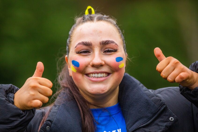 Ruby Swain, from the Abertay Netball team, cheering the teams on at the Riverside Playing Fields.