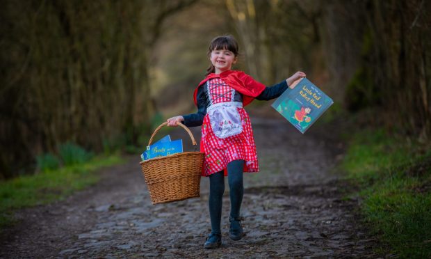 CR0047269 - Cheryl Peebles Story   - Perthshire area  - World Book Day standalone / preview pic for social - Picture shows Little Red Riding Hood, Clara (aged 6) from Perth taking a shortcut through the woods to visit Granny -- St Magdalenes Hill, Perth - Monday 4th March 2024 - - Image: Steve MacDougall/DC Thomson
