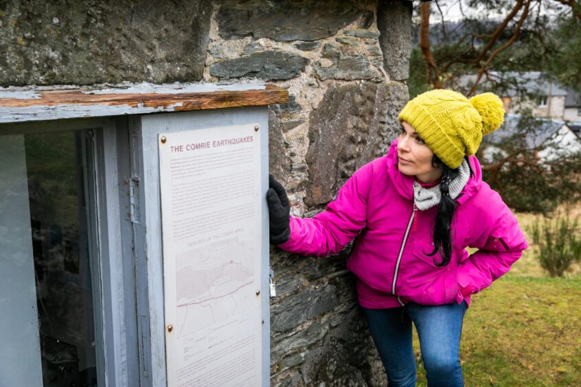 Gayle Ritchie checks out some of the information about the earthquake house. Image: Steve Brown.