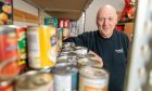 Tam McGeary at the community pantry he setup at Tayview Primary School. Image: Steve Brown/DC Thomson