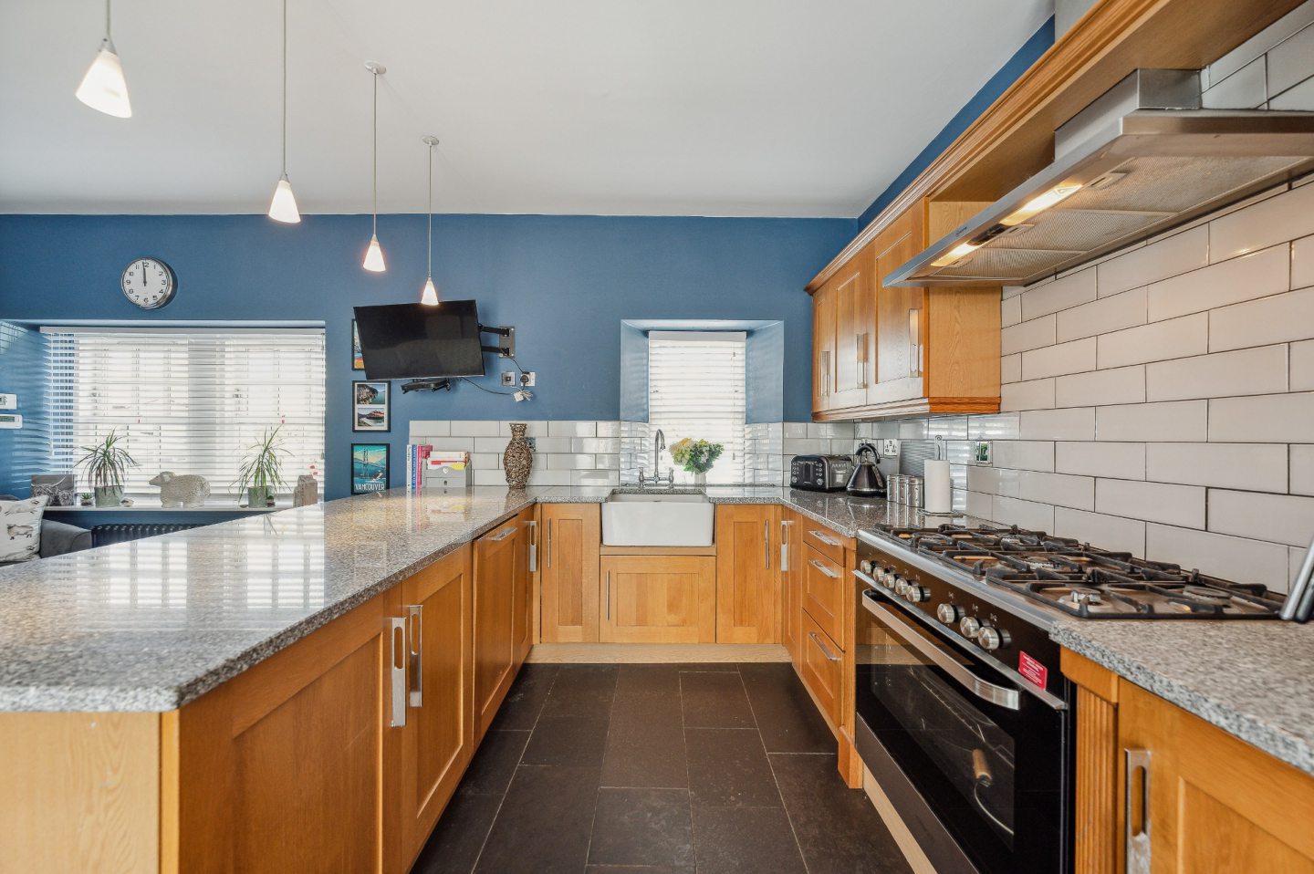 The kitchen has luxury touches such as an integrated cooker and Belfast sink