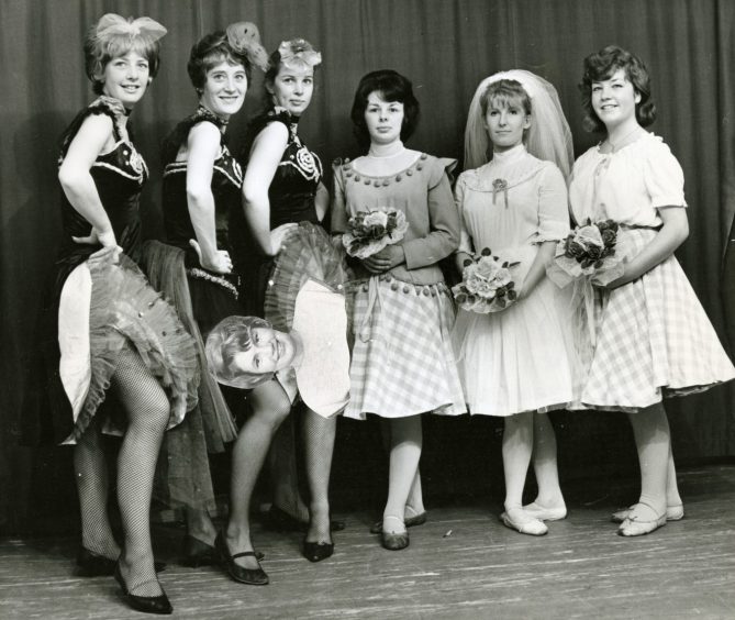 Six cast members in their costumes for a photocall in 1964. 