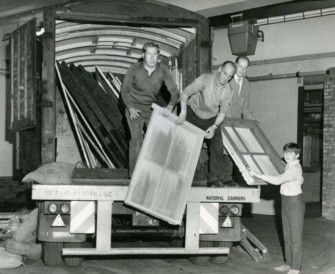 Unloading the scenery from a van for a stage production by the Thomson-Leng Musical Society in 1973. 