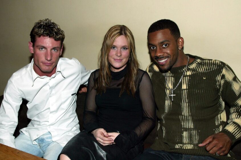 Dean Gaffney and Richard Blackwood with Julie Duncan, who got to meet the pair in 2003. 