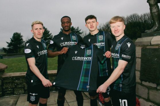 (L to R) Luke McCowan, Zach Robinson, Owen Beck and Lyall Cameron model Dundee's new third kit. Image: Dundee FC