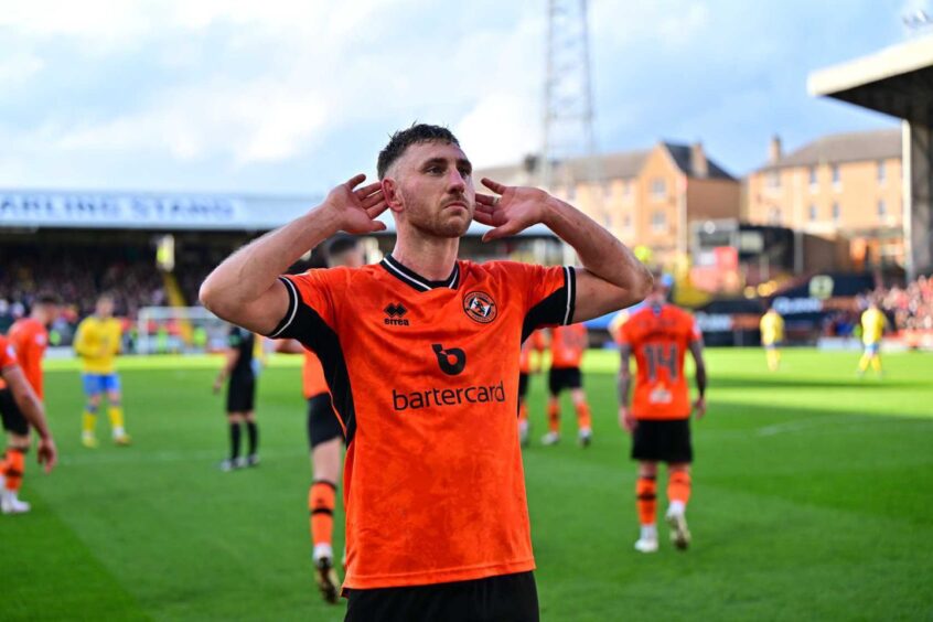 Louis Moult takes the acclaim of Dundee United fans.