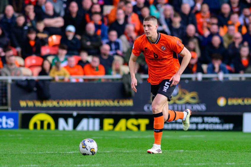 Sam McClelland strides out from the back for Dundee United 